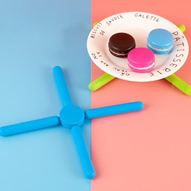 Foldable Cross Silicone Trivets - The Ultimate Kitchen Utility | Introducing our Kitchen Utility Foldable Cross Silicone Trivets, the ultimate companion to elevate y