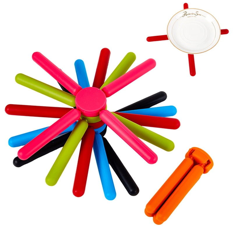 Foldable Cross Silicone Trivets - The Ultimate Kitchen Utility | Introducing our Kitchen Utility Foldable Cross Silicone Trivets, the ultimate companion to elevate y