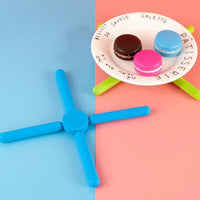 Foldable Cross Silicone Trivets - The Ultimate Kitchen Utility  | Introducing our Kitchen Utility Foldable Cross Silicone Trivets, the ultimate companion to elevate y